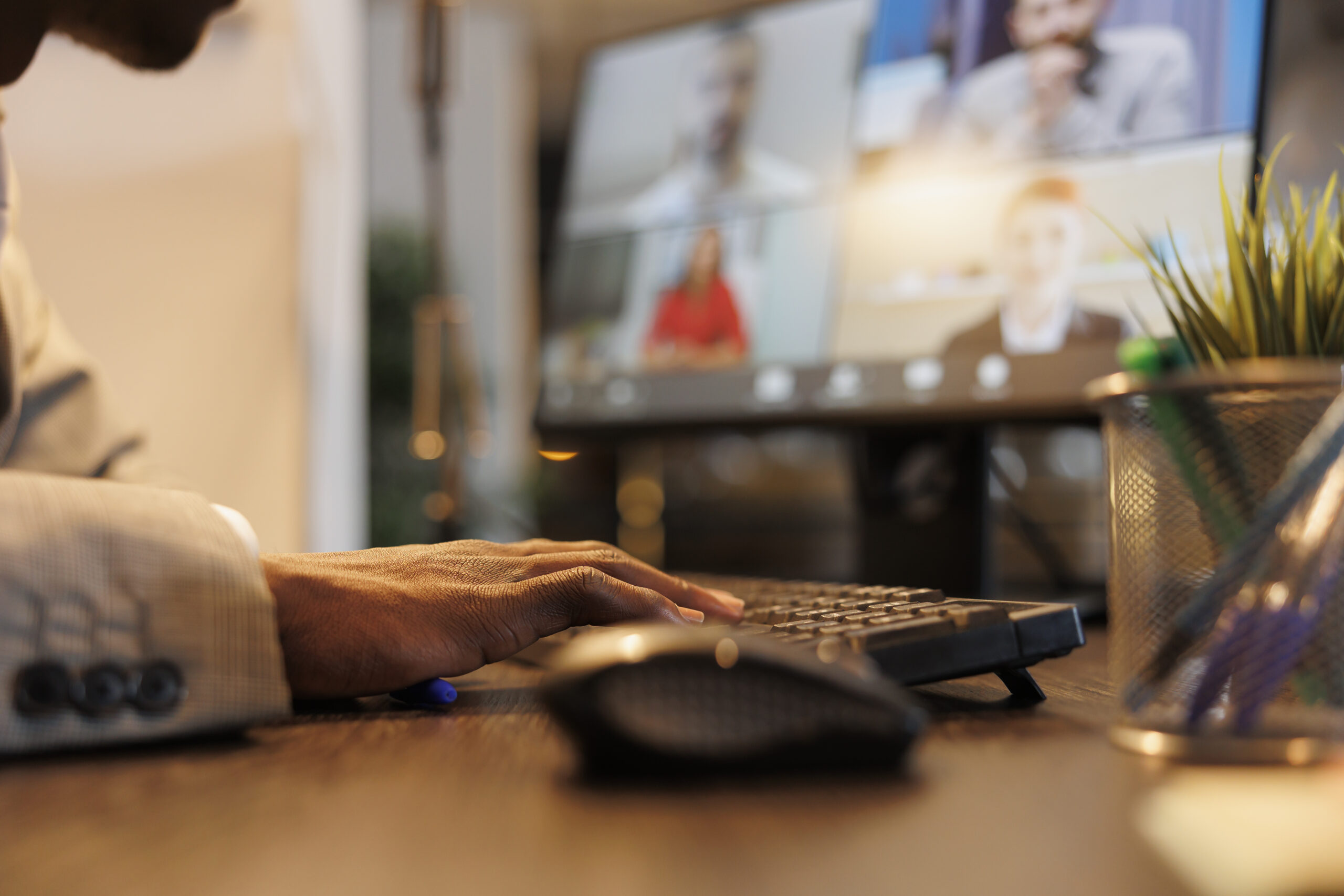 Businessman discussing marketing statistics with remote team during online videocall meeting conference. Diverse colleagues working over hours at company strategy in startup office