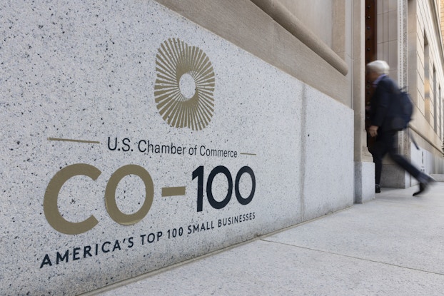  Exterior of the U.S. Chamber of Commerce building with CO—100 branding on it.