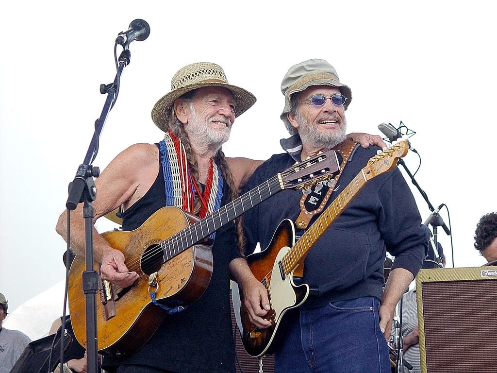 Merle Haggard (R) performs with Willie Nelson during Willie Nelson's 4th of July Picnic in 2003