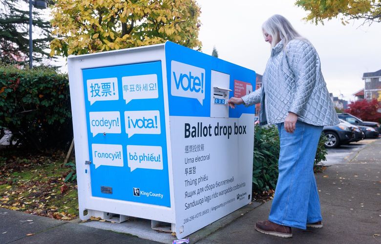 Wilma Stordahl drops off a ballot at the drop box at the High Point Library in West Seattle Tuesday, Nov.  4, 2025.