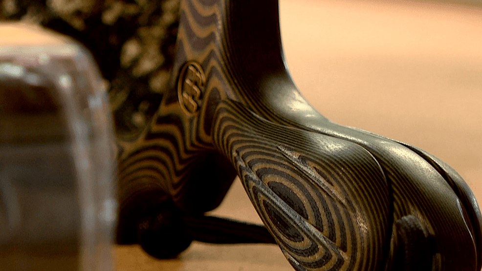 NOV. 7, 2025 - Local Woodfin business owner Nathan Master has his sights on reinvigorating a somewhat forgotten sport. Shooting cans off a fence post with a slingshot was common to many people's childhoods, and that sense of nostalgia is what Simpleshot is trying to tap into. (Photo: WLOS Staff)