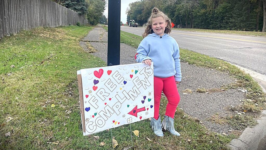 9-year-old girl offering free compliments is doing brisk business