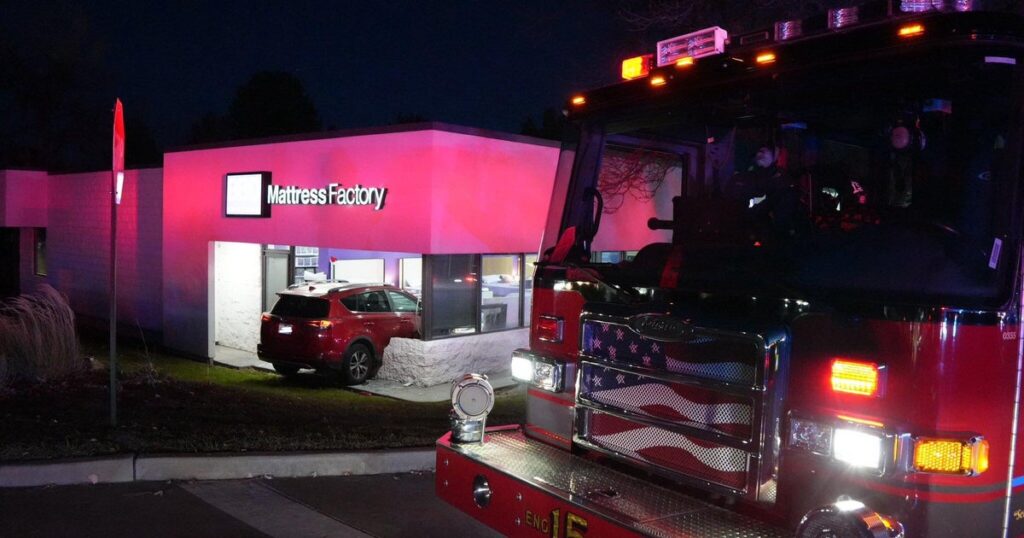 Employee at Denver metro area business narrowly avoids injury when vehicle crashes through wall