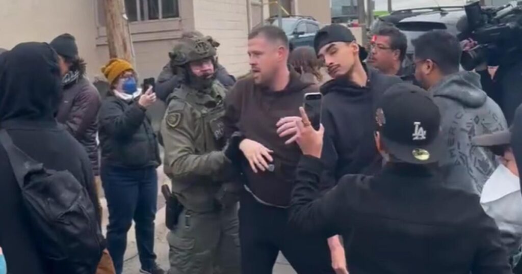 Federal agents clash with protesters outside St. Paul business