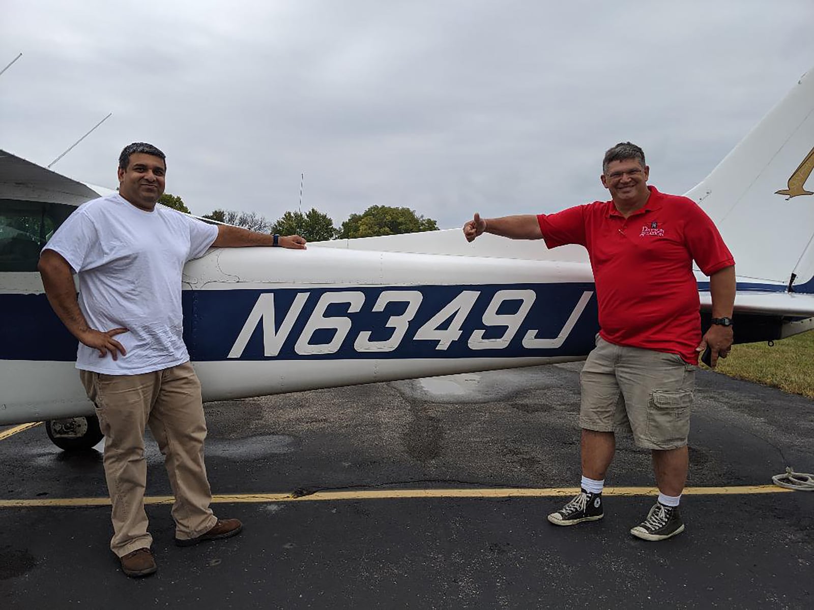 Ashwin Narayan (Left) after his first solo flight in February of 2019. He is shown with Rich Cox from Dayton Aviation Services who was his flight instructor.