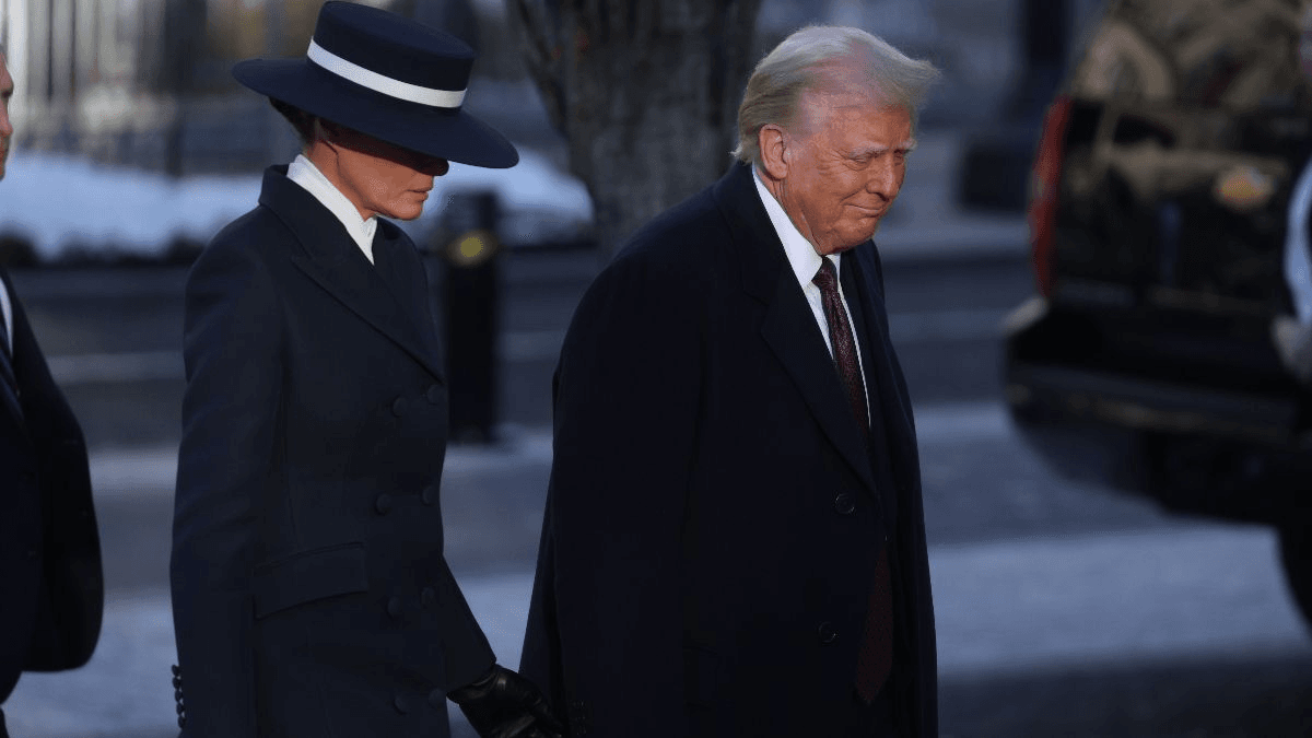Image may contain Donald Trump Clothing Coat Formal Wear Suit Adult Person Overcoat Accessories Tie and People