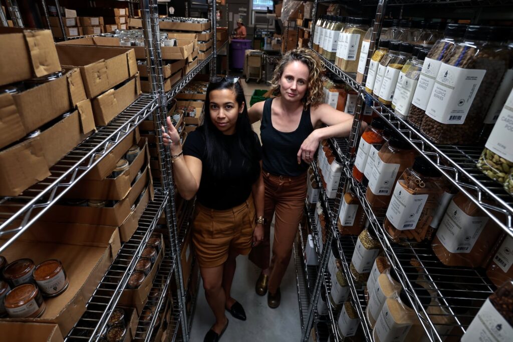 Claire Cheney (right) founder and "blender-in-chief" of Curio Spice Co., and Nikki Levick, its vice president, operations and finance, stood in the business's Winchester factory.