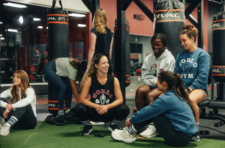 people talk inside a World Gym 