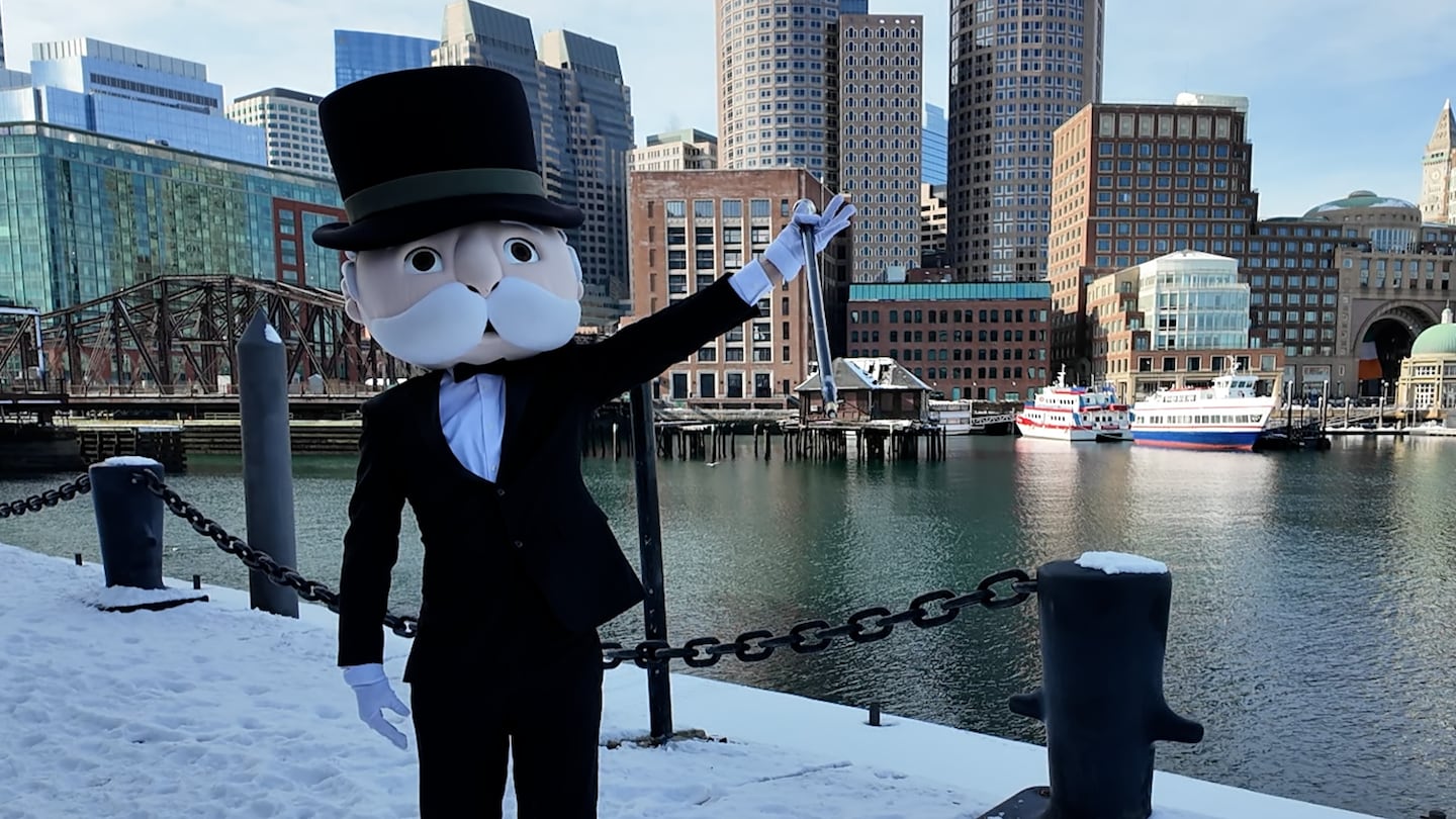 Mr. Monopoly stood in front of the Boston Harbor skyline during a visit to the city in January.