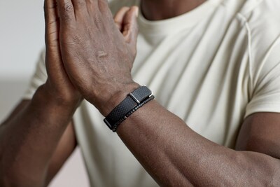 A person wearing the Hilo Band by Aktiia, a clinically validated, cuffless device designed to enable continuous blood pressure monitoring for long-term cardiovascular prevention.