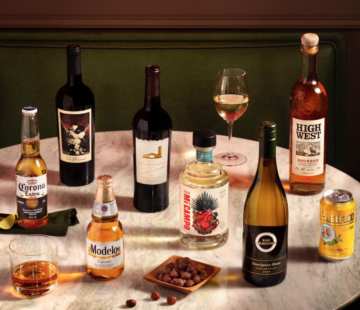 A table with various bottles of alcohol.
