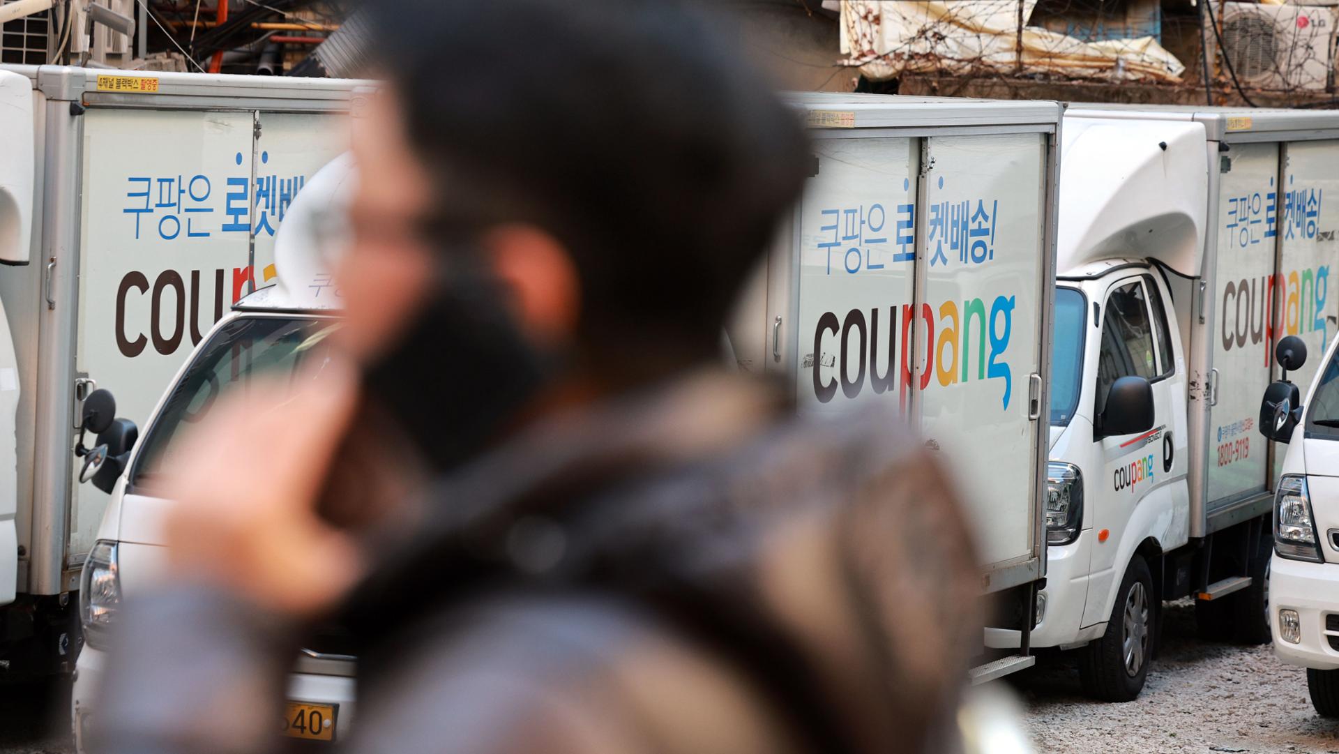Delivery trucks are parked at a Coupang logistics center in Seoul, Thursday. Yonhap