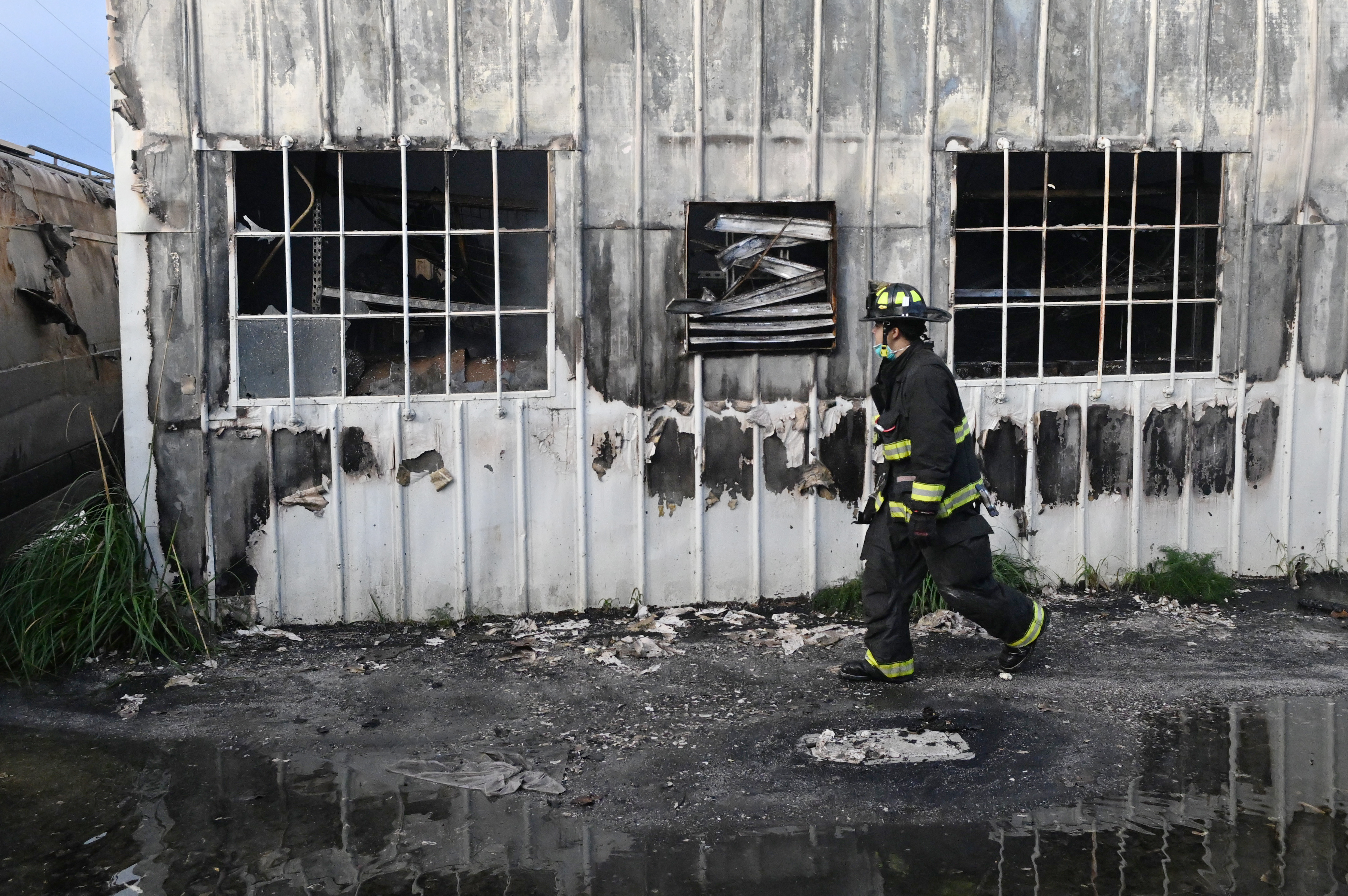 A Central Marin firefighter works at a fire at 44...