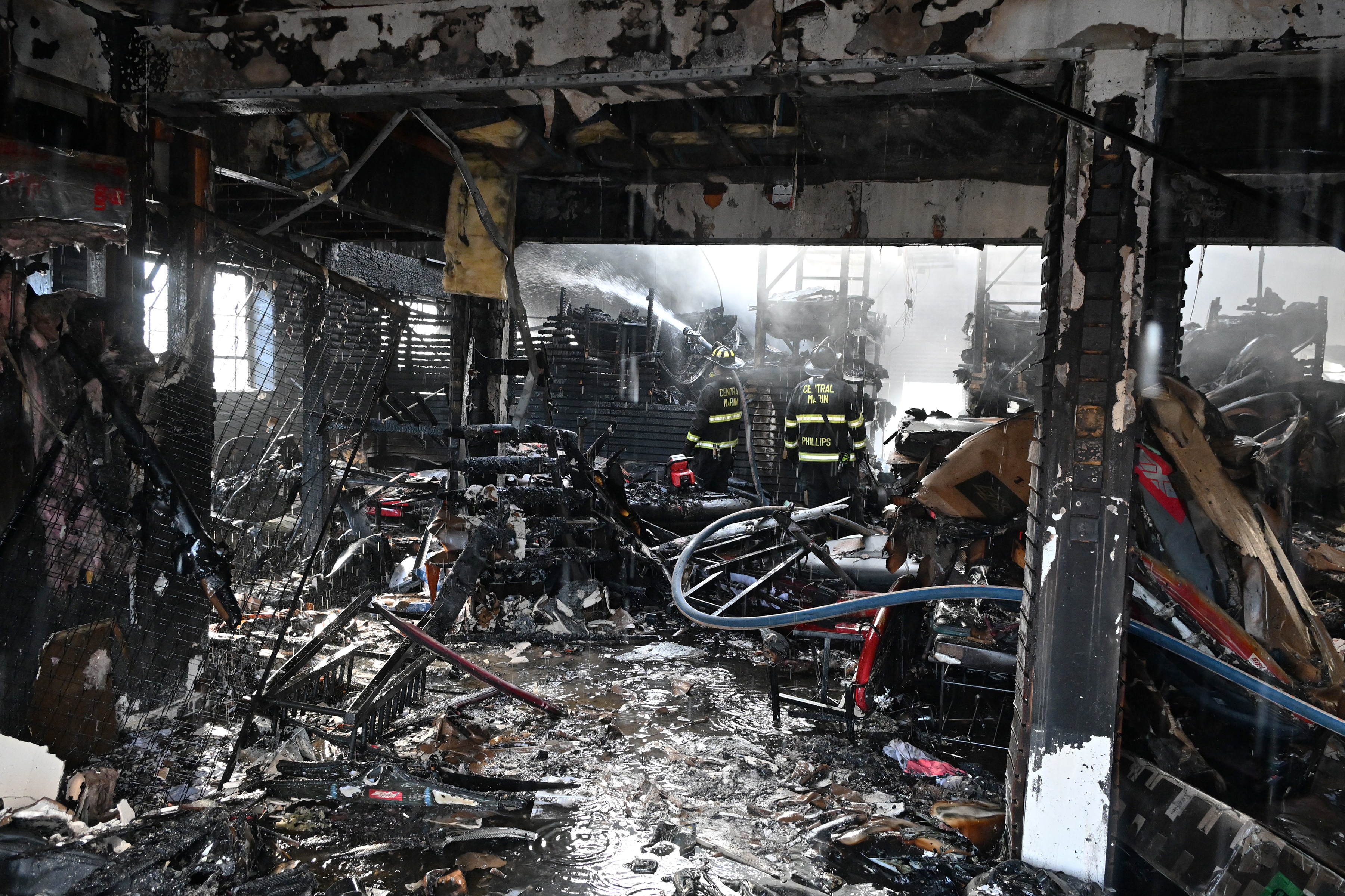 Central Marin firefighters work at a commercial fire at 44...