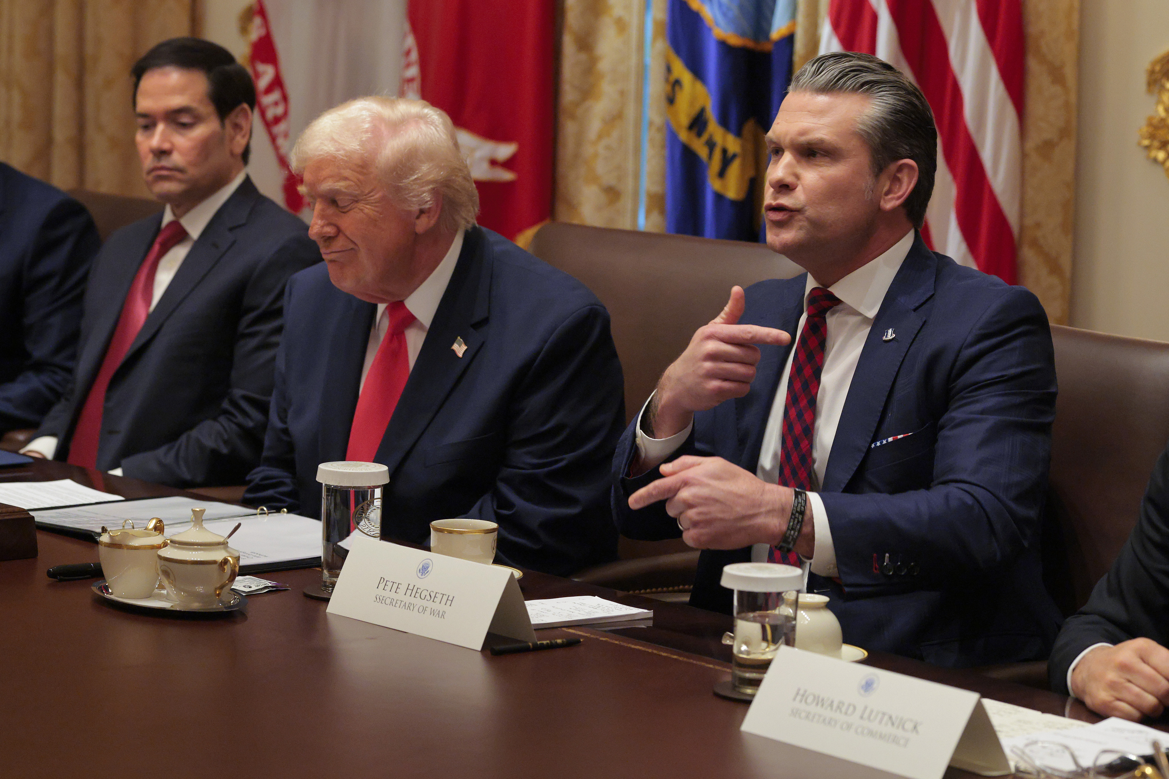 WASHINGTON, DC - DECEMBER 02: U.S. Secretary of War Pete Hegseth (R) speaks alongside (L-R) U.S. Secretary of State Marco Rubio and U.S. President Donald Trump during a Cabinet meeting in the Cabinet Room of the White House on December 02, 2025 in Washington, DC. A bipartisan Congressional investigation has begun regarding Secretary of War Pete Hegseth's role in ordering U.S. military strikes on small boats in the waters off Venezuela that have killed scores of people, which Hegseth said are intended "to stop lethal drugs, destroy narco-boats and kill the narco-terrorists who are poisoning the American people.” (Photo by Chip Somodevilla/Getty Images)