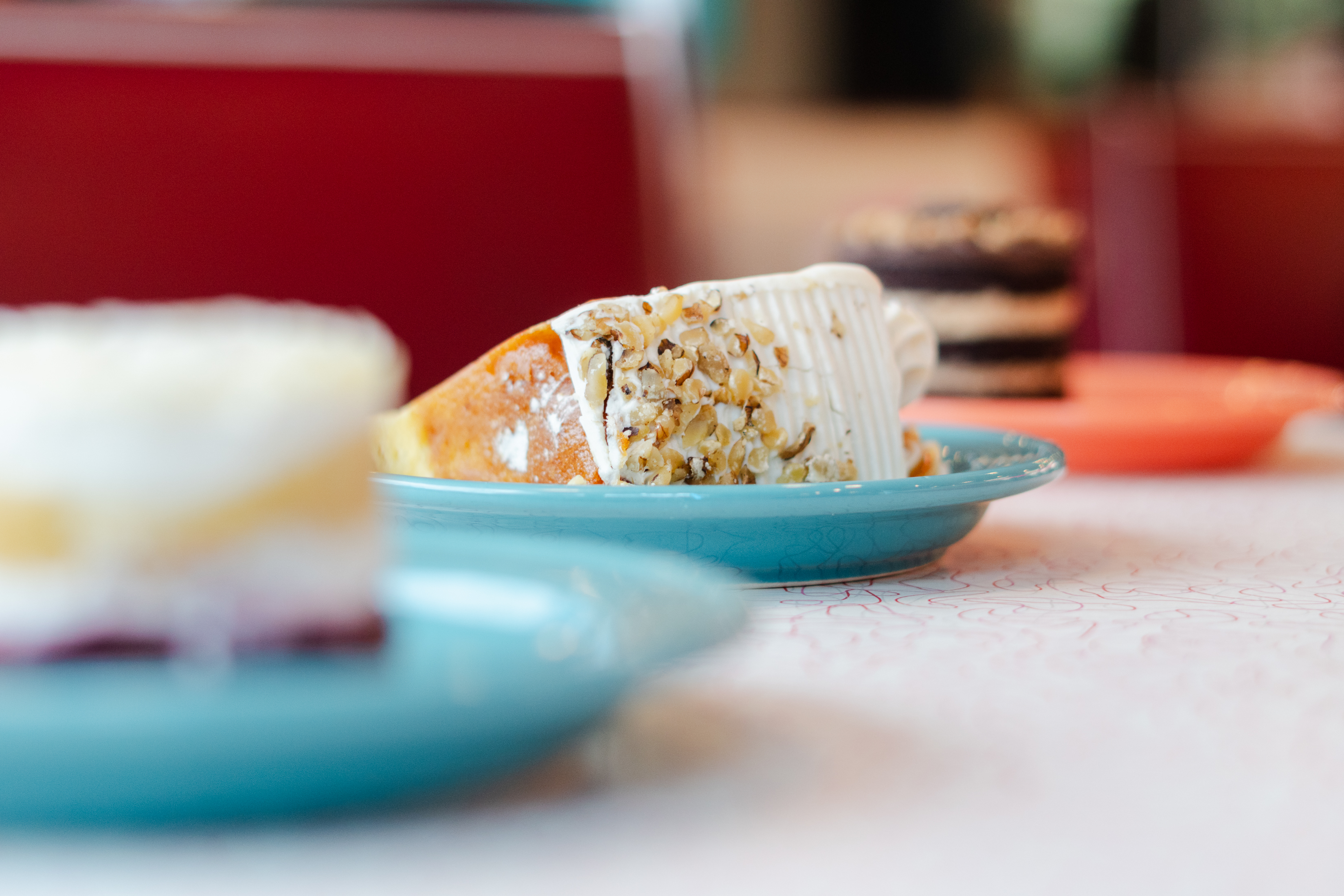 Several desserts sit at a table in the Manheim Diner...