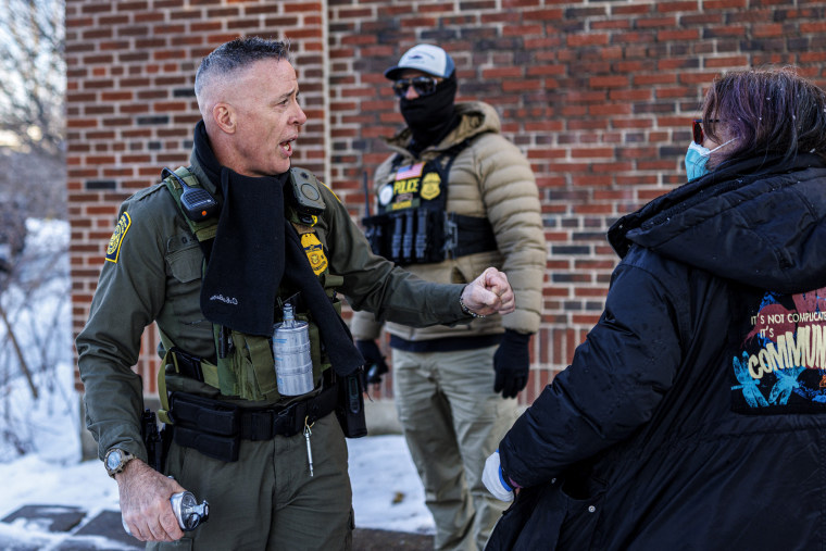 Image: U.S. Border Patrol Commander Gregory Bovino argues with protesters