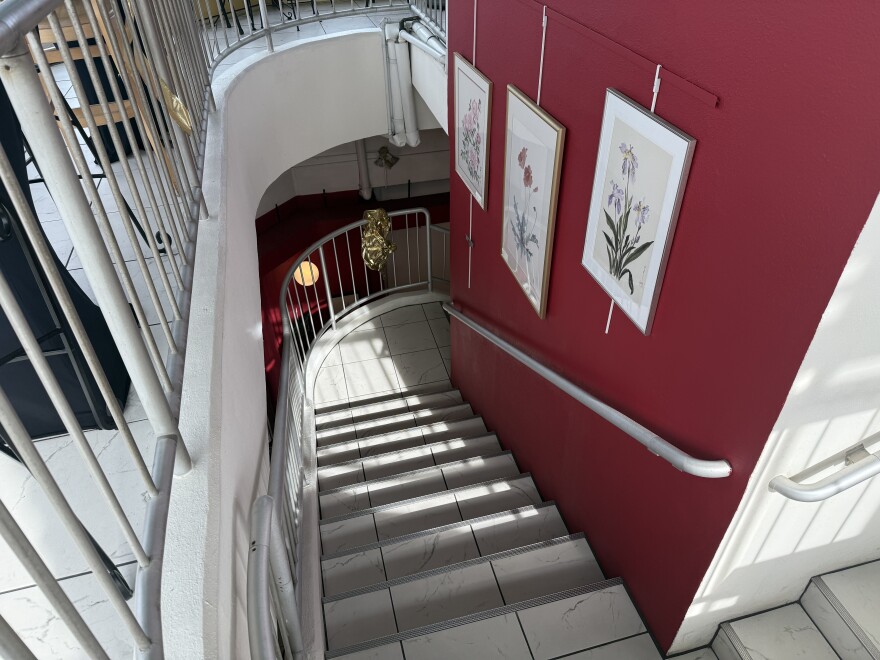 A spiral staircase and elevator takes visitors to the second floor.