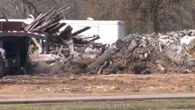 Evansville business agrees to put up a fence and stop burning materials