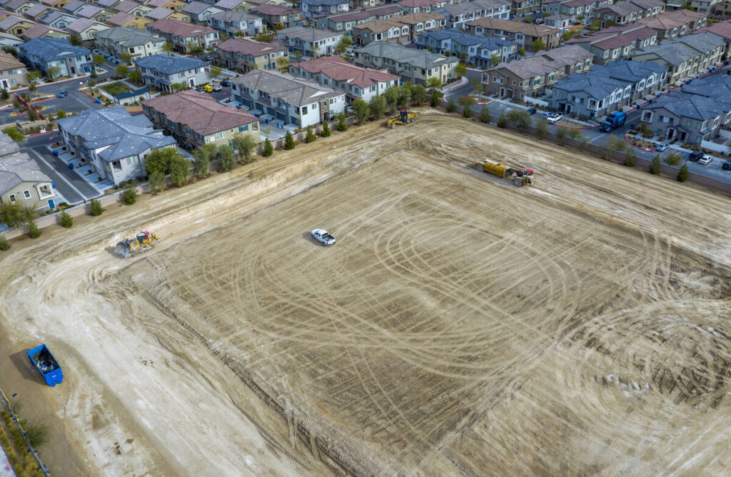Machinery moves about the construction site where a new Albertsons is planned on the 7300 block ...