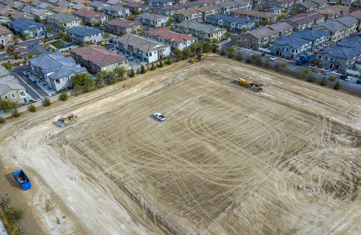 Machinery moves about the construction site where a new Albertsons is planned on the 7300 block ...