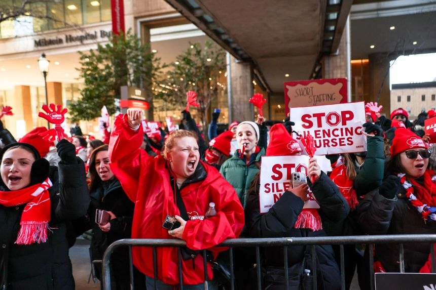 Nurses strike outside a hospital in New York City on January 12, 2026. Nearly 15,000 nurses have gone on strike.