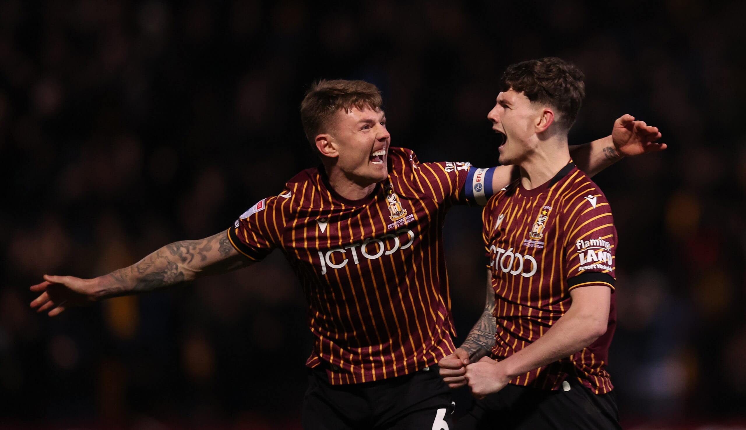 Bradford City's Jenson Metcalfe celebrates with team-mate Max Power during a League One game against Port Vale in December