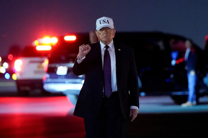 President Donald Trump pumps his fist after disembarking Air Force One at Palm Beach International Airport in West Palm Beach, Florida, U.S., February 27, 2026.