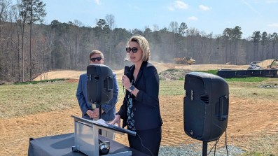 Chapel Hill Mayor Jess Anderson speaks during the topping-off ceremony held by South Creek, where she shared her support for the project's plans to add a variety of housing options and businesses. (Photo by Brighton McConnell/Chapel Hill Media Group.)