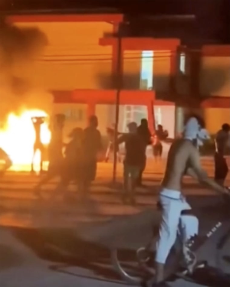 Anti-government protesters outside a Communist Party office in Moron, northern Cuba, early on Saturday.