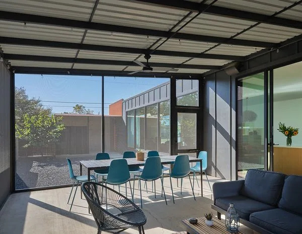 Both sliding glass and screens create an indoor-outdoor environment that maximizes space.
