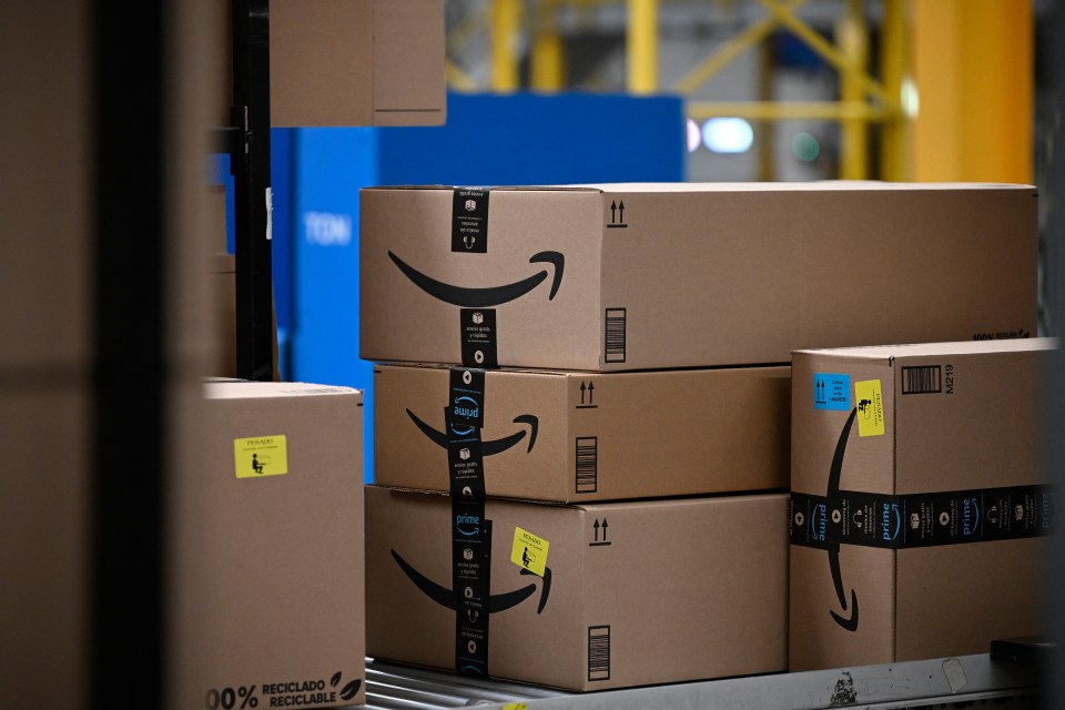 Packages with the Amazon logo at an Amazon distribution center.