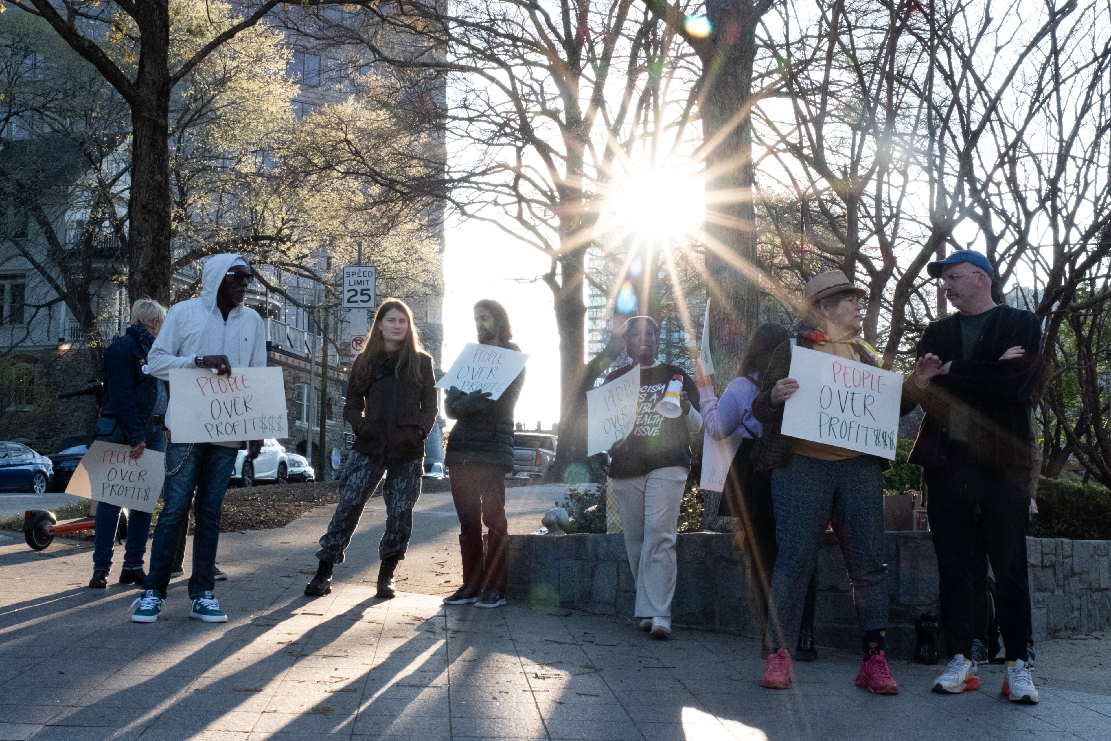 A small group of protesters gathers outside of Woodruff Arts Center as Mayor Andre Dickens delivers the State of the City address Wednesday, March 18, 2026. (Ben Gray for the AJC)