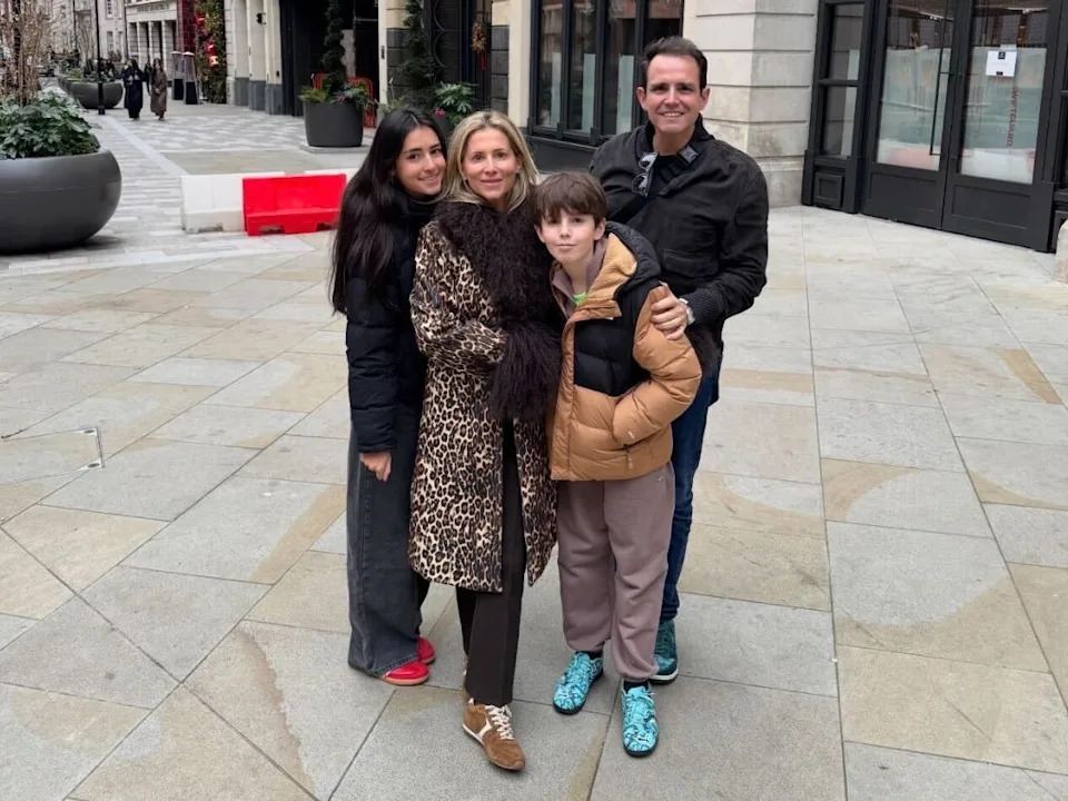 family posing for photo