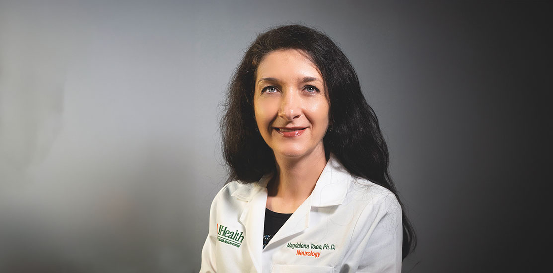 Dr. Magdalena Tolea, in white medical coat