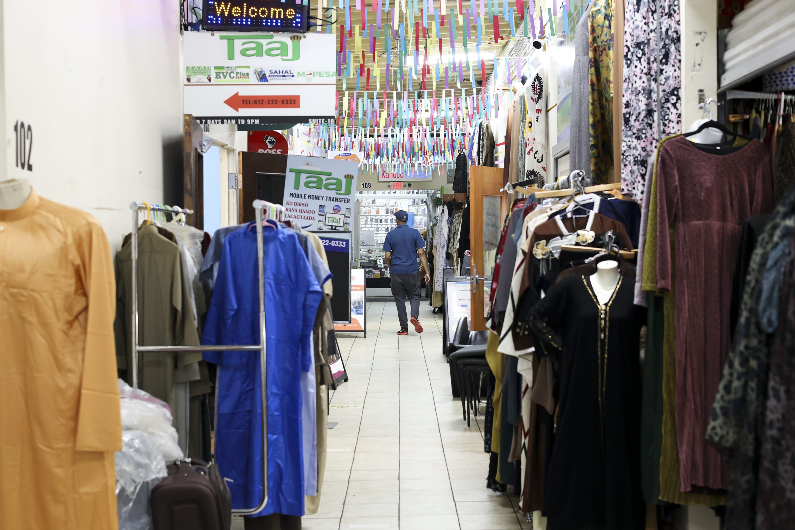A person walks through the hallway at Madina Mall, which houses many Somali-run small businesses