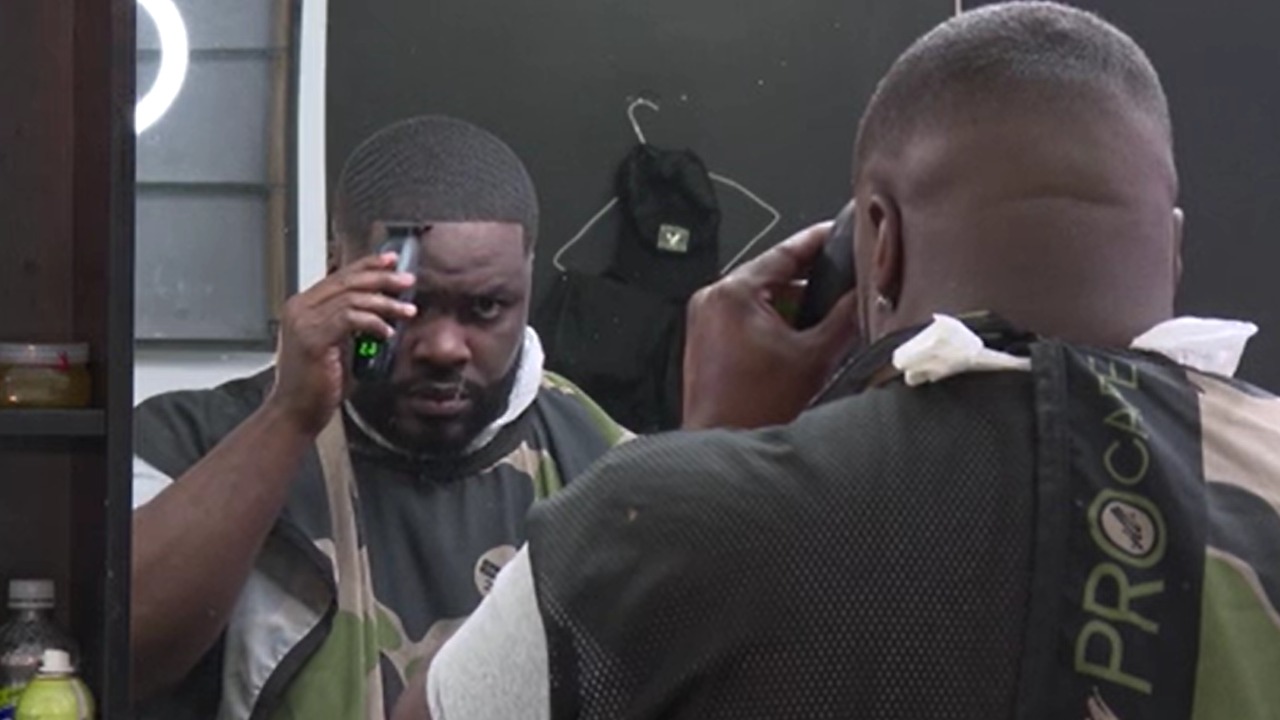 Barber reflects on shooting outside of his business