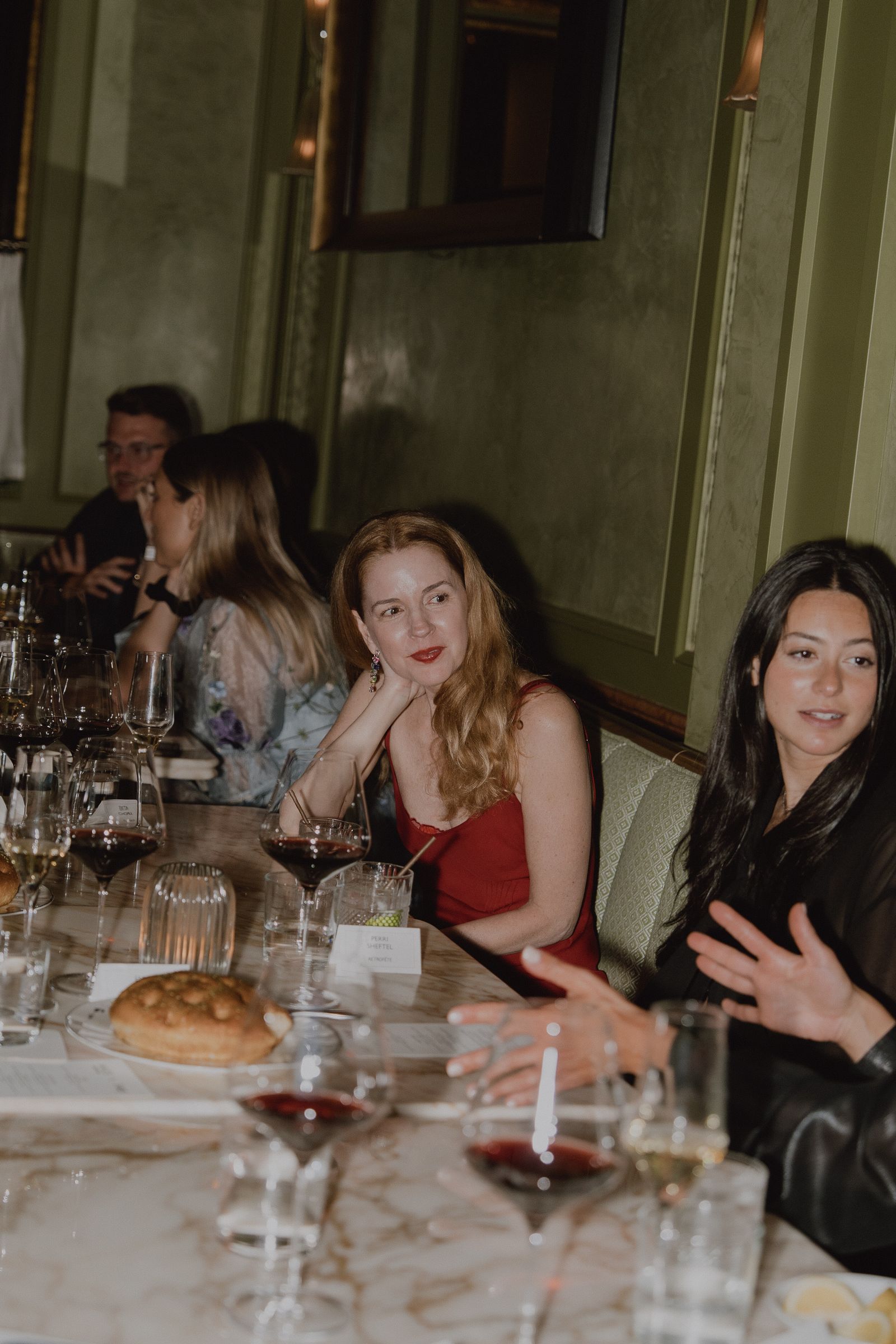 Image may contain Suzanne Collins Adult Person Bread Food Urban Accessories Glasses Fun Party Cup and People