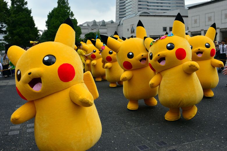 Dozens of Pikachu characters, the famous character of Nintendo's videogame software Pokemon, parade at the Landmark Plaza shopping mall in Yokohama, Tokyo, in August 2014.