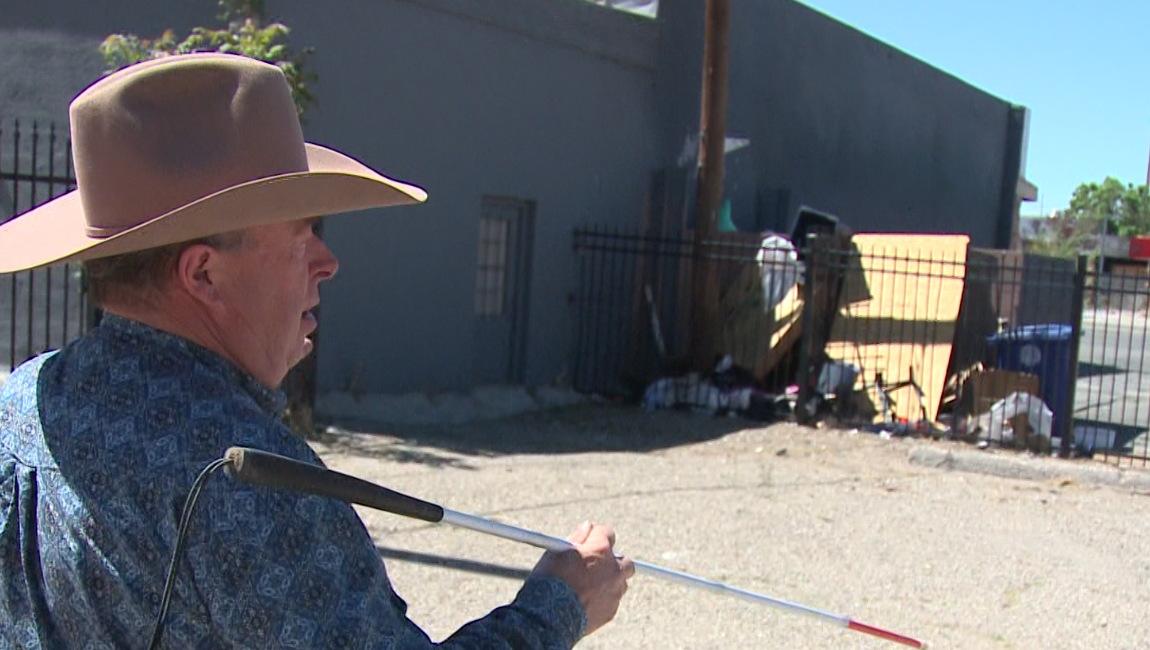 Business owner gets cited after picking up needles and trash