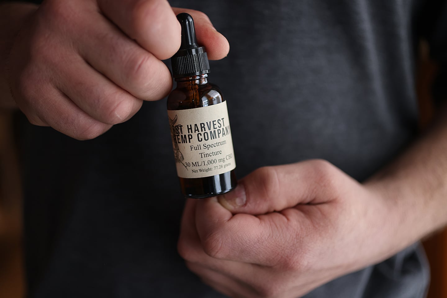 Kevin McGovern held some of the CBD tincture he makes at First Harvest Hemp Co.